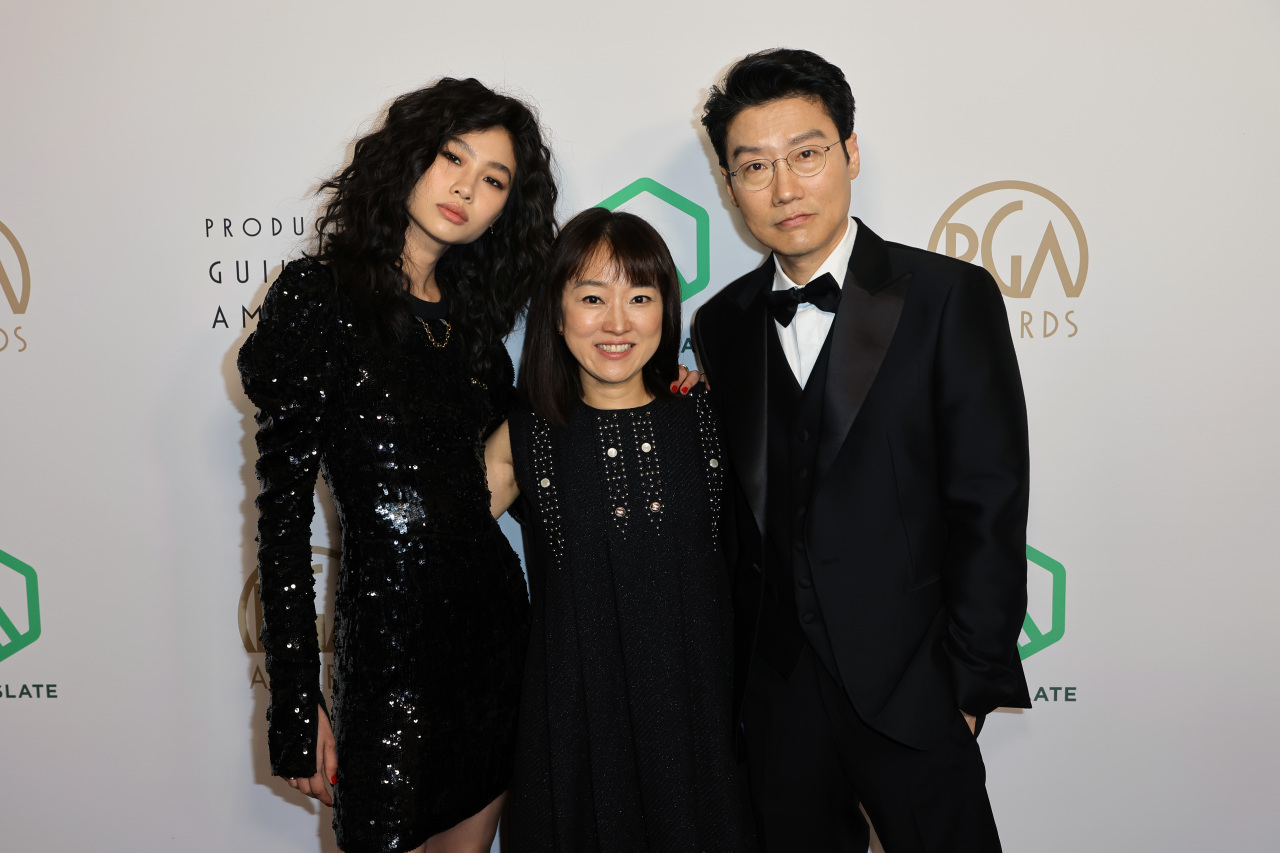 From left: Actor Jung Ho-yeon, Siren Pictures CEO Kim Ji-yeon and director Hwang Dong-hyuk attend the 33rd Annual Producers Guild Awards at Fairmont Century Plaza on March 19, in Los Angeles, California. (Getty Images)