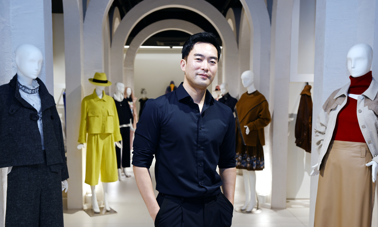Lee Chung-chung, CEO and creative director of LIE, poses for photos during an interview with The Korea Herald at a LIE showroom in southern Seoul, last week. (Park Hyun-koo/The Korea Herald)
