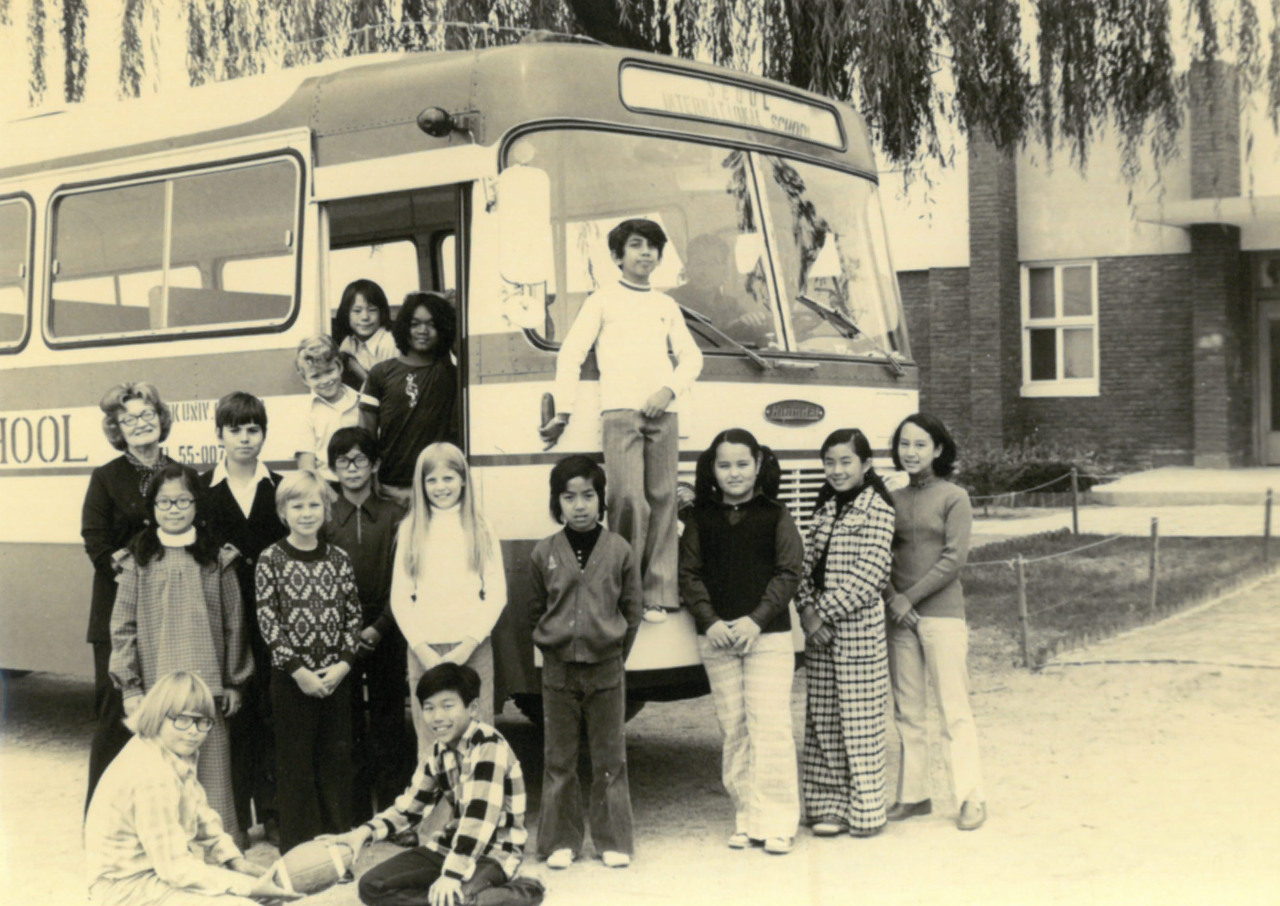 Students pose around a school bus in this file photo of the Seoul International School. Seoul International School
