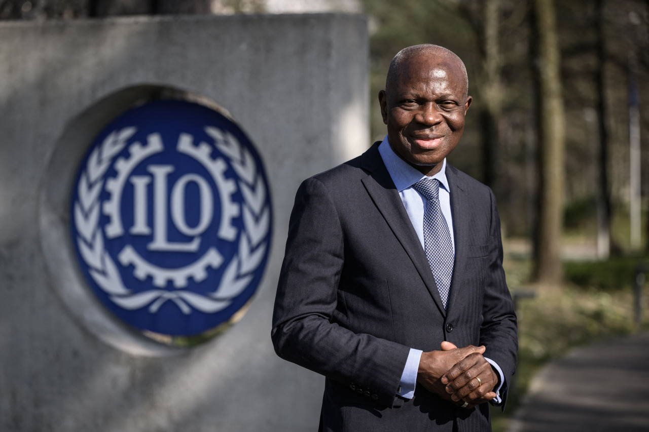 New International Labour Organization (ILO) Director-General Gilbert Houngbo poses after he was elected last Friday in Geneva. - Houngbo, a former prime minister of Togo, was elected the next head of the International Labour Organization, and will become the first African to lead the UN agency. (AFP)