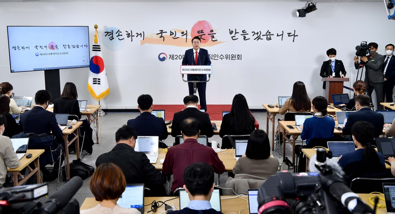 President Yoon Suk-yeol (center) speaks during a press briefing. (Yonhap)