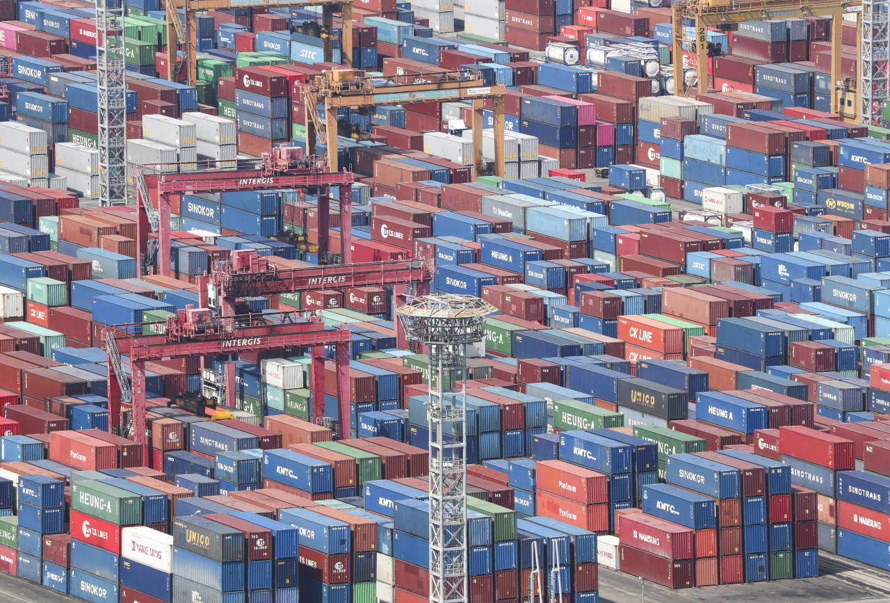 This file photo, taken last Tuesday, shows stacks of containers at a port in South Korea's southeastern city of Busan. (Yonhap)