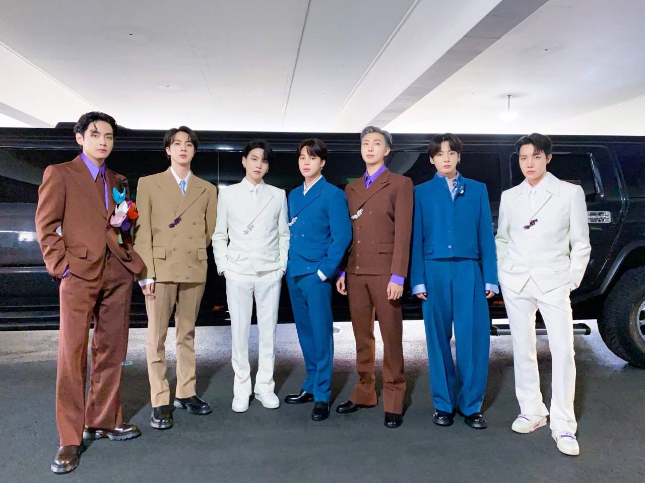 Members of K-pop sensation BTS pose for photos after arriving at the MGM Grand Garden Arena in Las Vegas to attend the 64th Grammy Awards on April 3. (BTS’ official Twitter)