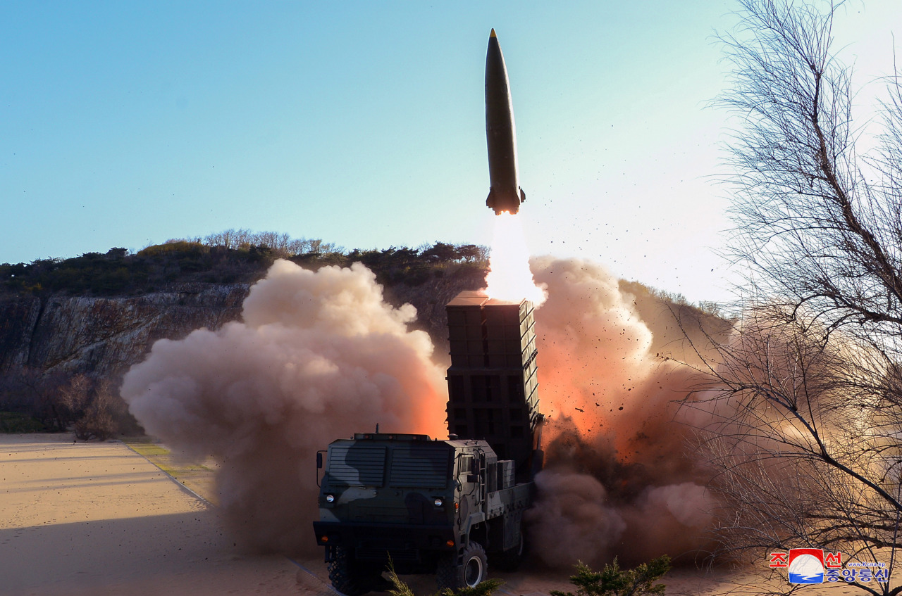 A new type of tactical guided weapon is launched from a transporter erector launcher in a photo released by North Korea‘s state-run Korean Central News Agency on Sunday. (Yonhap)