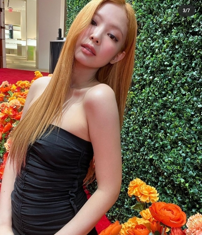Jennie of Blackpink is seen with vivid orange hair. (Jennie’s Instagram)