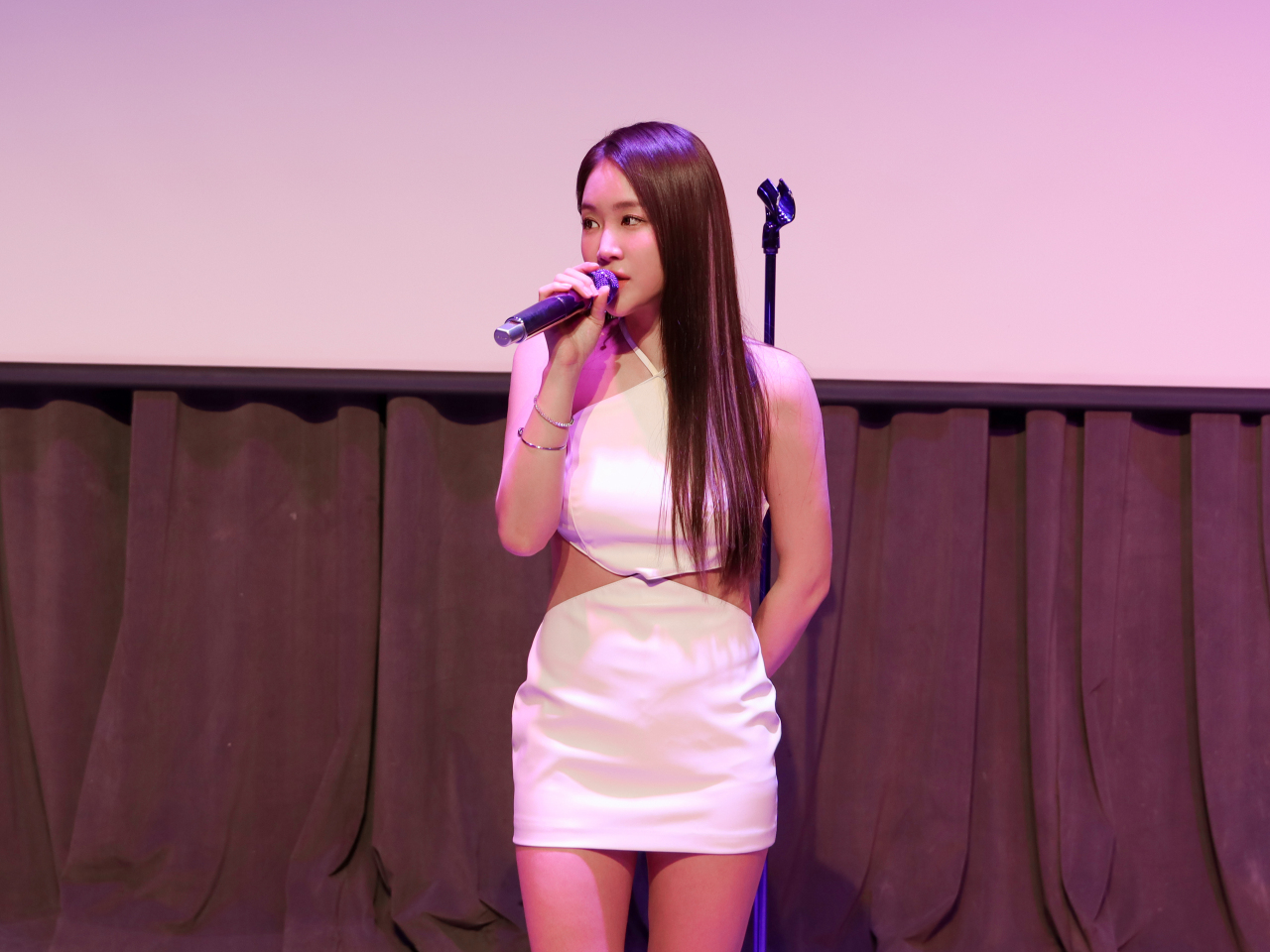 Singer Soyou performs onstage during a press showcase event held ahead of the release of her first mini-album “Day&Night,” in Seoul, Wednesday. (BPM Entertainment)