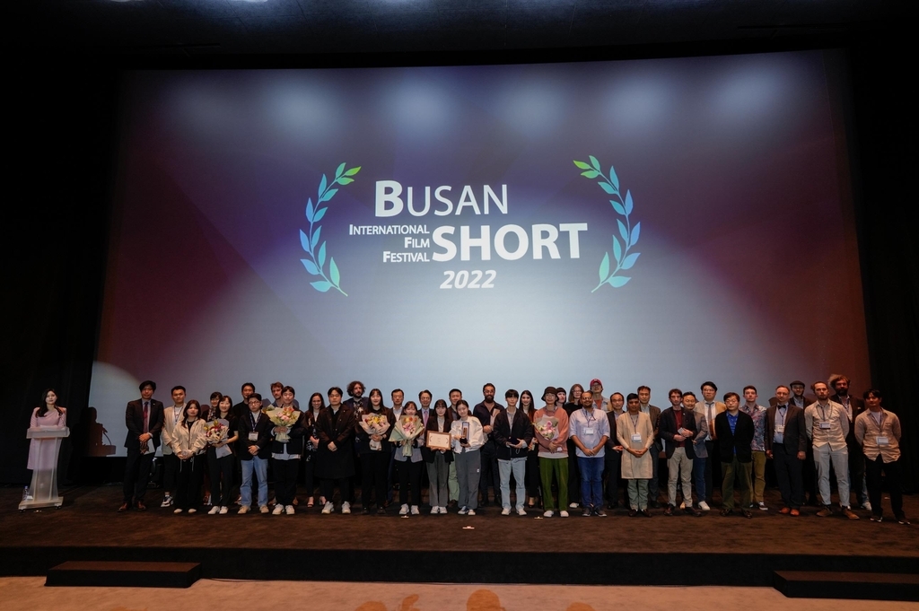 Participants of the 39th Busan International Short Film Festival pose for group photos at the closing ceremony held at the Busan Cinema Center on Monday. (BISFF)