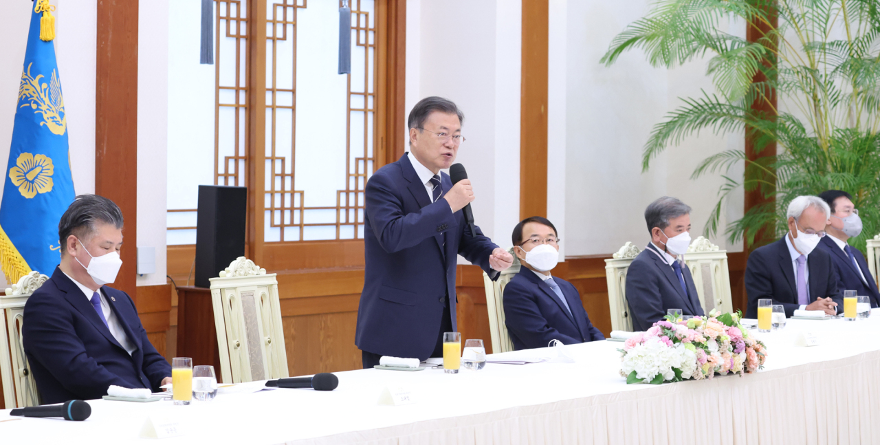 President Moon Jae-in speaks Friday during a publishing event for a series of books detailing the accomplishments made during his five-year term as the president, which consists of 22 books with a total of 11,944 pages, the largest volume of any book series released by an outgoing president in South Korea. (Yonhap)