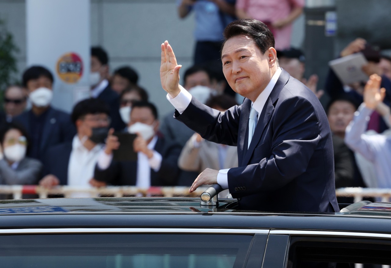 President Yoon Suk-yeol waves at his supporters following the inauguration ceremony for him held at the National Assembly in Yeouido, western Seoul, on Tuesday. (Joint Press Corps)