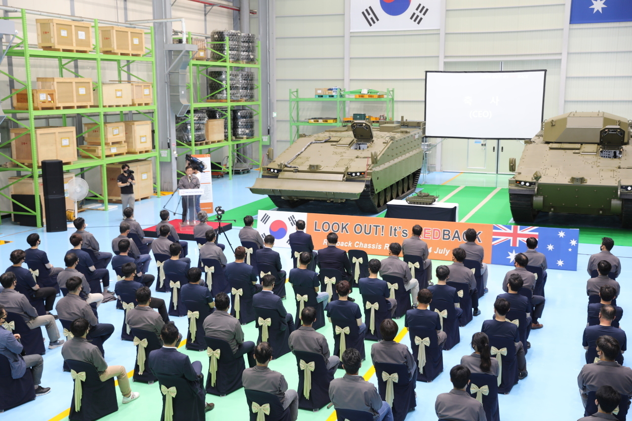 Employees at Hanwha Defense celebrate the unveiling of the locally built infantry fighting vehicle Redback in Changwon, South Gyeongsang Province, July 24, 2020. (Hanwha Defense)