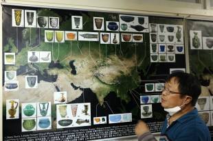 Park Cheun-Soo, a professor and director of the Silk Road Survey & Research Center at the Kyungpook National University in Daegu, stands in front of a map showing artifacts found along the Steppe Route, the original ancient Silk Road along the plains of central Eurasia that ends at Silla Kingdom.