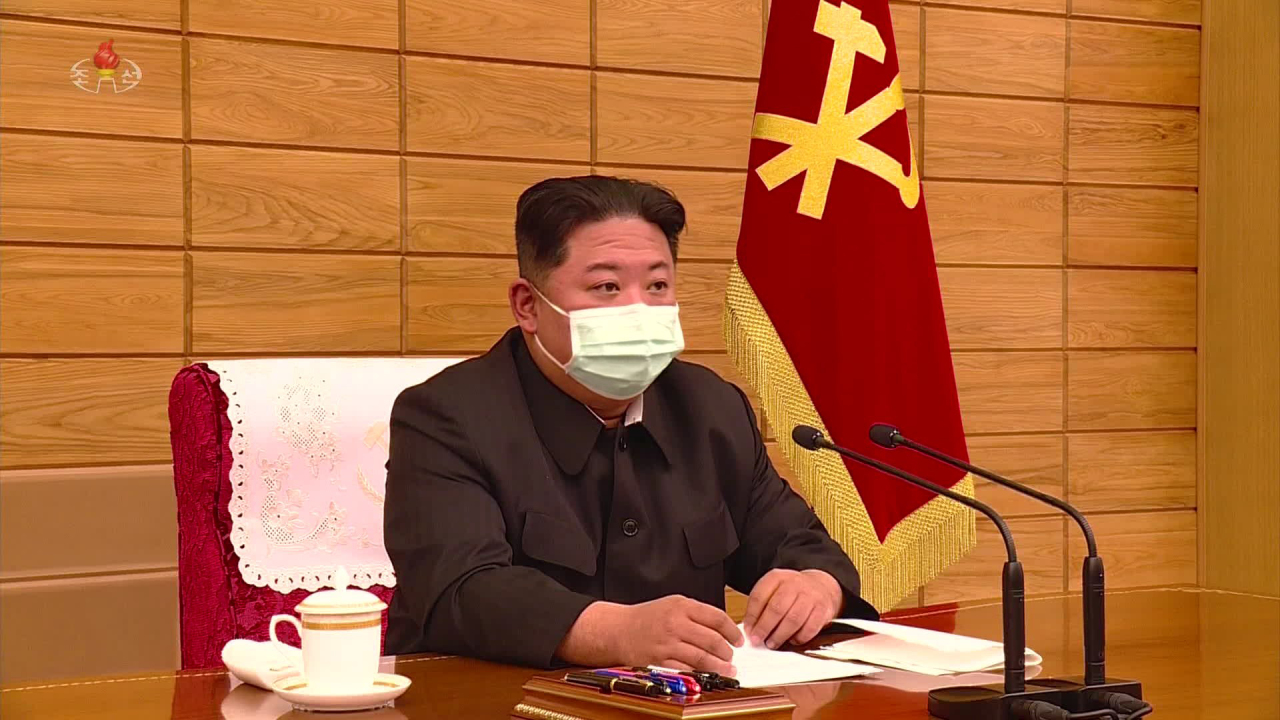 In this photo released by the Korean Central News Agency, North Korean leader Kim Jong-un is seen wearing a face mask at a politburo meeting of the ruling Workers` Party held Saturday. (Yonhap)
