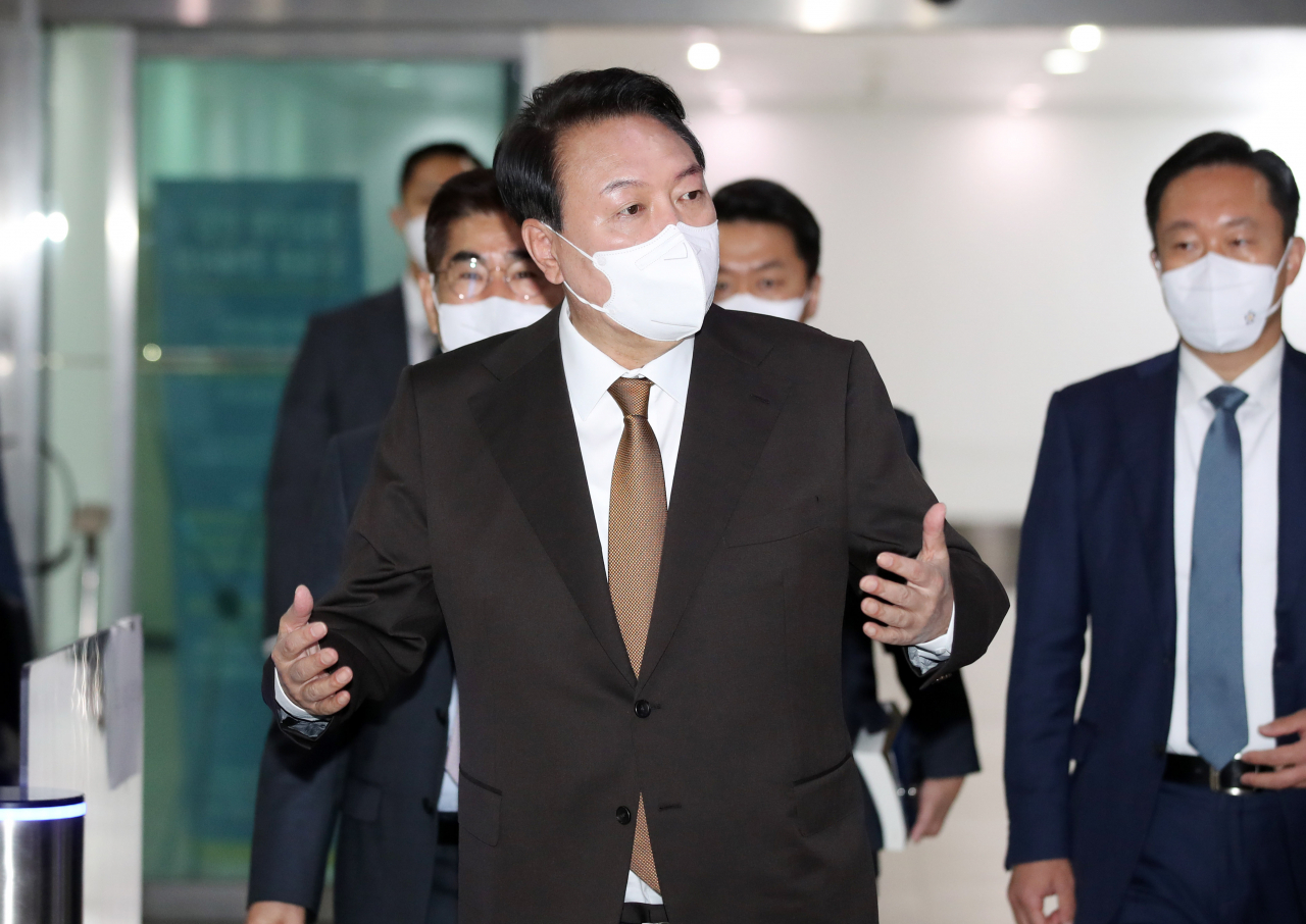 President Yoon Suk-yeol speaks to reporters as he arrives for work at the presidential office in Seoul on Tuesday. (Yonhap)
