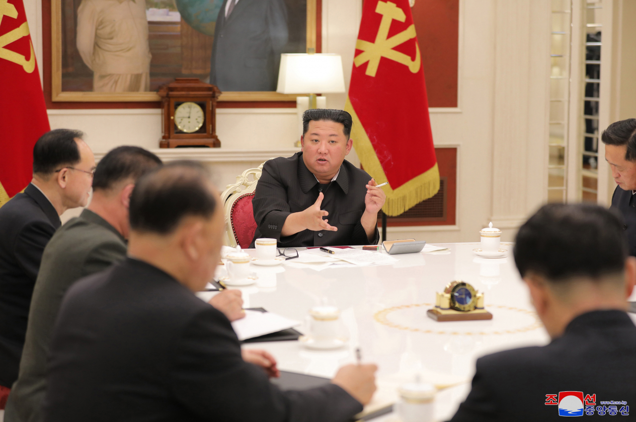 North Korean leader Kim Jong-un (C) presides over a meeting of the Presidium of the Political Bureau of the Central Committee of the Workers' Party at the headquarters of the Central Committee in Pyongyang on Tuesday, in this photo released by the North's official Korean Central News Agency. In the meeting to discuss nationwide antivirus measures, Kim urged officials to stabilize the pandemic situation after North Korea reported its first COVID-19 case last week. (Yonhap)