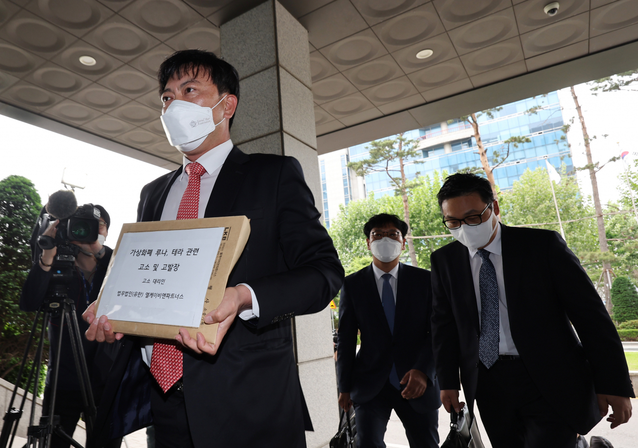 Lawyers from LKB & Partners representing South Korean investors in two main tokens of Terraform Labs head to the Seoul Southern District Prosecutors Office on Thursday, to file complaints against Do Kwon, the embattled cryptocurrency firm's co-founder and CEO, and co-founder Daniel Shin. (Yonhap)