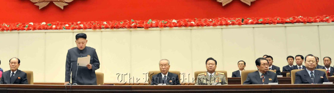 Jang Song-thaek (right), the uncle of North Korean leader Kim Jong-un (left), looks inattentive and bored during the country’s ruling Worker’s Party’s high-level meeting on Jan 28, 2013. (Yonhap News)