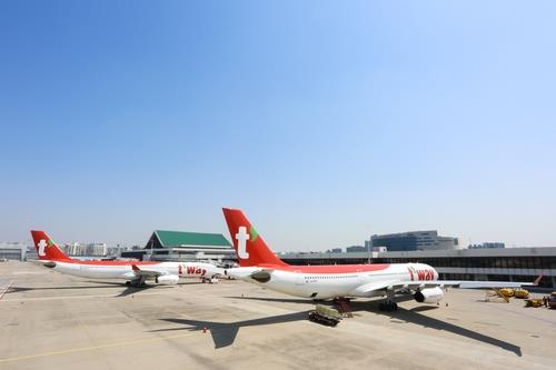 This file photo provided by T'way Air shows its A330-300 chartered planes at Incheon International Airport in Incheon, just west of Seoul. (T'way Air)