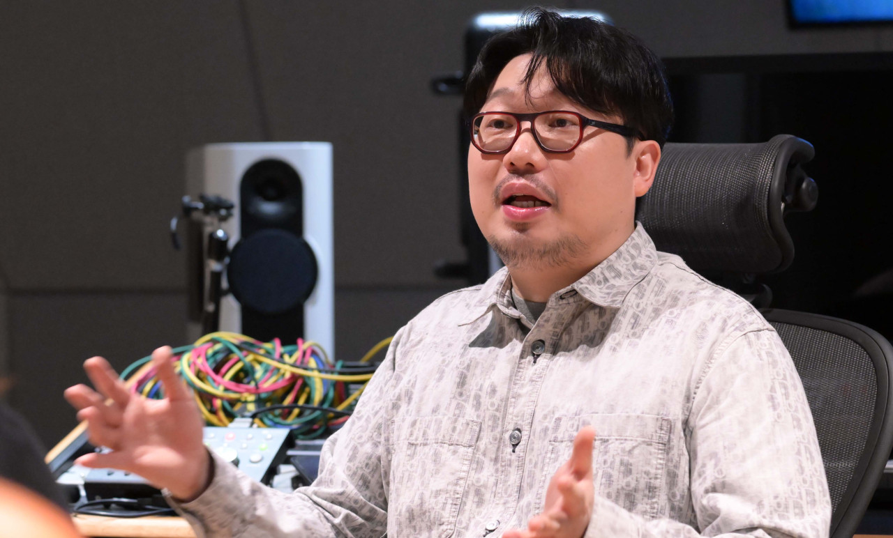 Big Hit Music producer Pdogg poses for photos during an interview with The Korea Herald at Hybe’s headquarters in Yongsan-gu, Seoul, on Tuesday. (Lee Sang-sub/The Korea Herald)