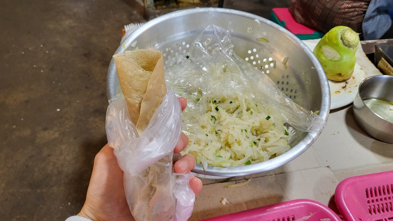 A typical bingtteok sold at Sehwa market for 1,000 won a piece. (Kim Hae-yeon/ The Korea Herald)