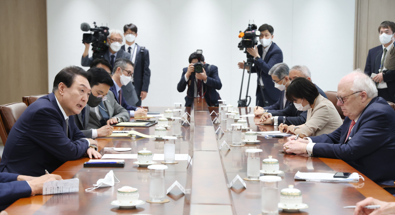 President Yoon Suk-yeol speaks at a meeting with former and current members of US academia in the presidential office on Friday. (Yonhap)
