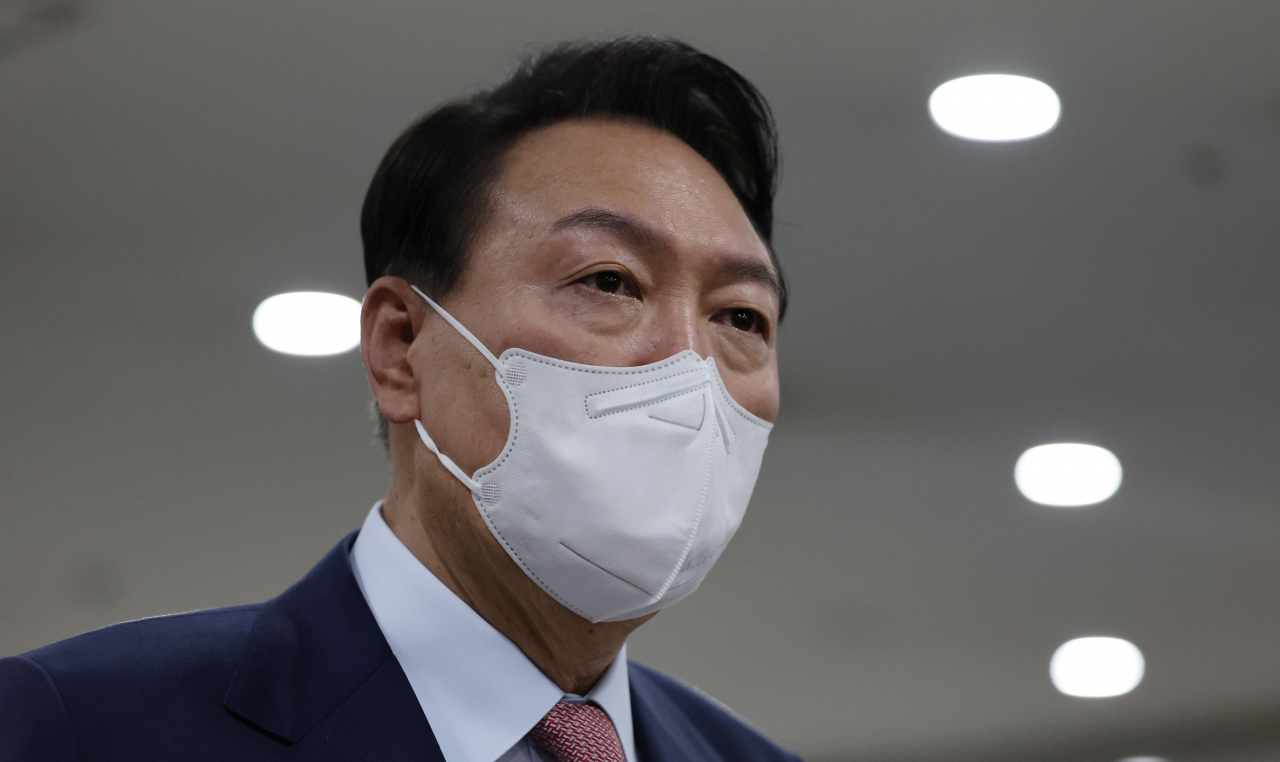 President Yoon Suk-yeol speaks to reporters as he arrives at the presidential office in Seoul on Thursday. (Yonhap)