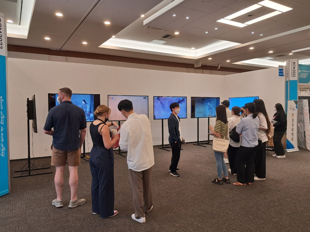 Visitors enjoy media art presented at the “Art Content & Board Game IP Market” exhibition at Busan Content Market. (Lee Si-jin/The Korea Herald)