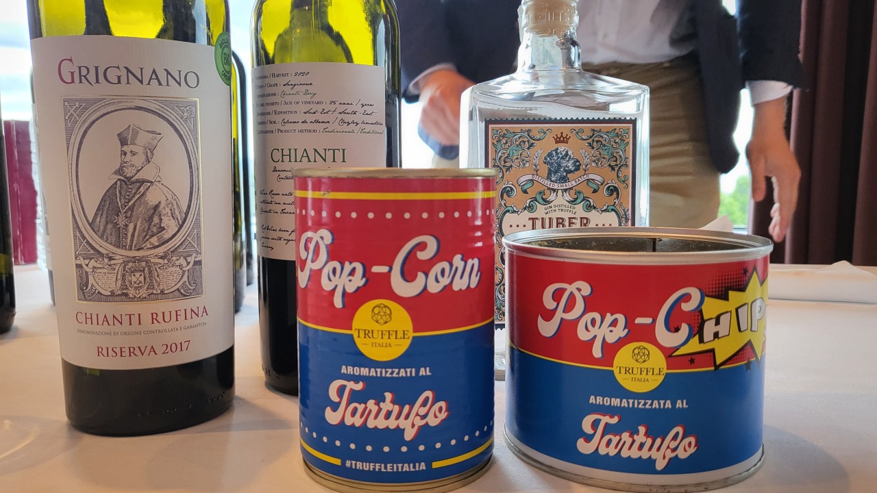 A bottle of Truffle Gin and canned truffle popcorns are on display at the 2022 Chianti lovers Asian Tour. (Kim Hae-yeon/ The Korea Herald)