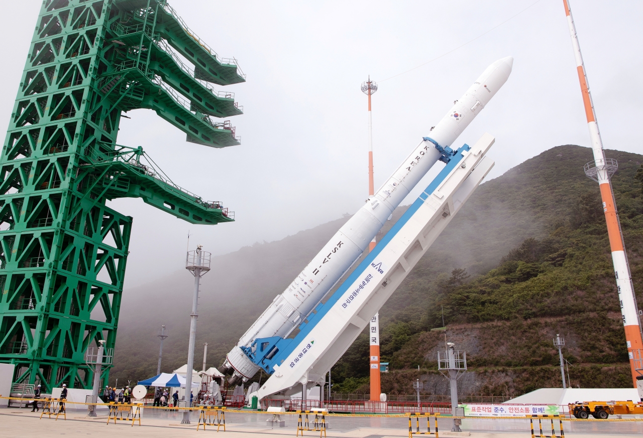 South Korea’s homegrown Nuri rocket is being erected on the launch pad at Naro Space Center in Goheung, South Jeolla Province on Monday, a day before its rescheduled launch on Tuesday. (Korea Aerospace Research Institute)