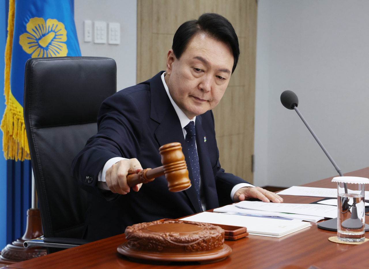 President Yoon Suk-yeol presides over a Cabinet meeting at the Yongsan Presidential Office in Seoul on Tuesday. (Yonhap)
