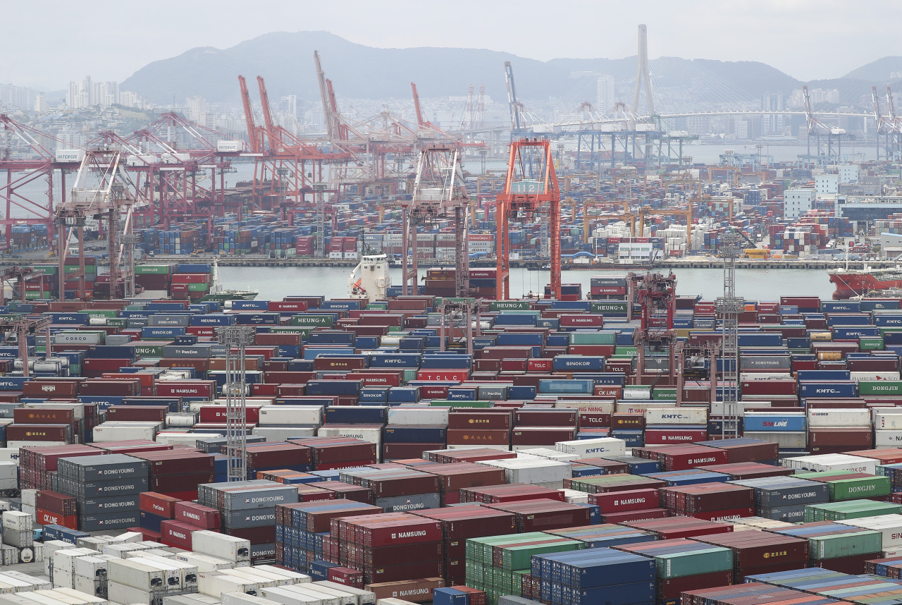 Containers are stacked at Sinseondae pier in Busan. (Yonhap)