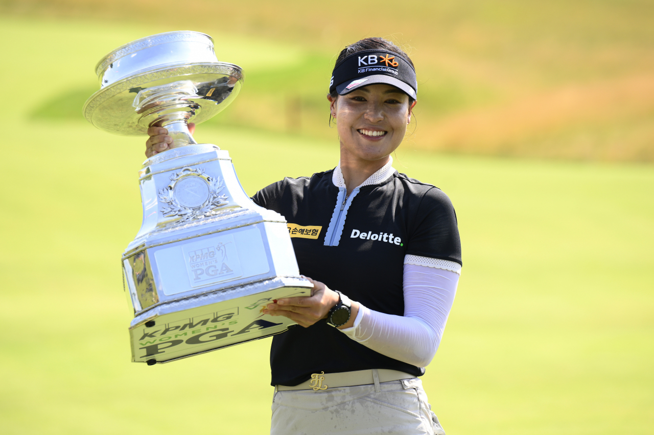 In this Associated Press photo, Chun In-gee of South Korea holds the champion's trophy after winning the KPMG Women's PGA Championship at the Congressional Country Club's Blue Course in Bethesda, Maryland, on Sunday. (AP)