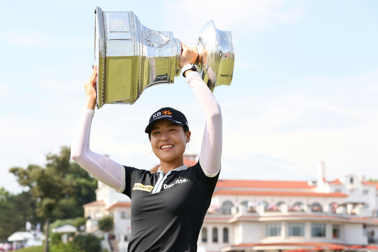 In this Getty Images photo, Chun In-gee of South Korea hoists the champion's trophy after winning the KPMG Women's PGA Championship at the Congressional Country Club's Blue Course in Bethesda, Maryland, on Sunday. (Getty Images)