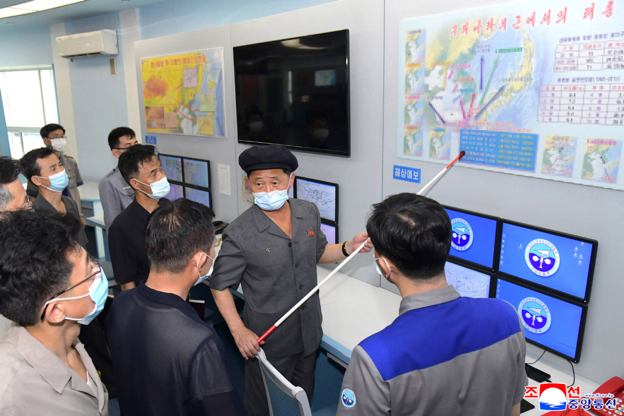 North Korean Premier Kim Tok-hun (2nd from R) inspects the State Hydro-Meteorological Administration, in this undated photo released by the North's Korean Central News Agency on Wednesday. (KCNA)