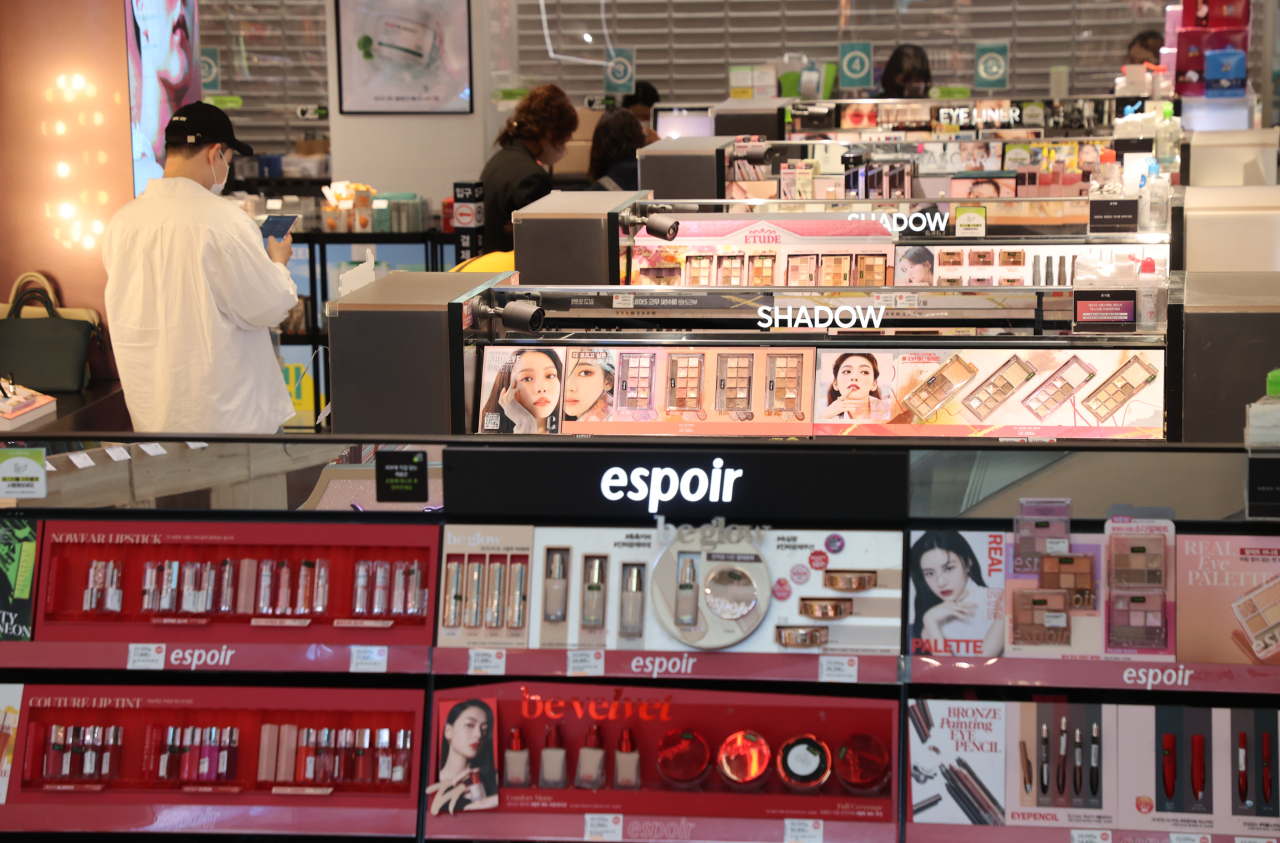 A man walks through the cosmetics aisle of an Olive Young branch in Seoul, earlier this month. (Yonhap)