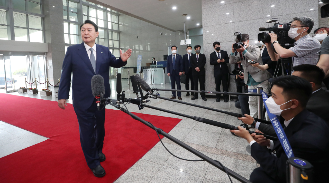 President Yoon Suk-yeol take questions from the press on Friday. (Yonhap)