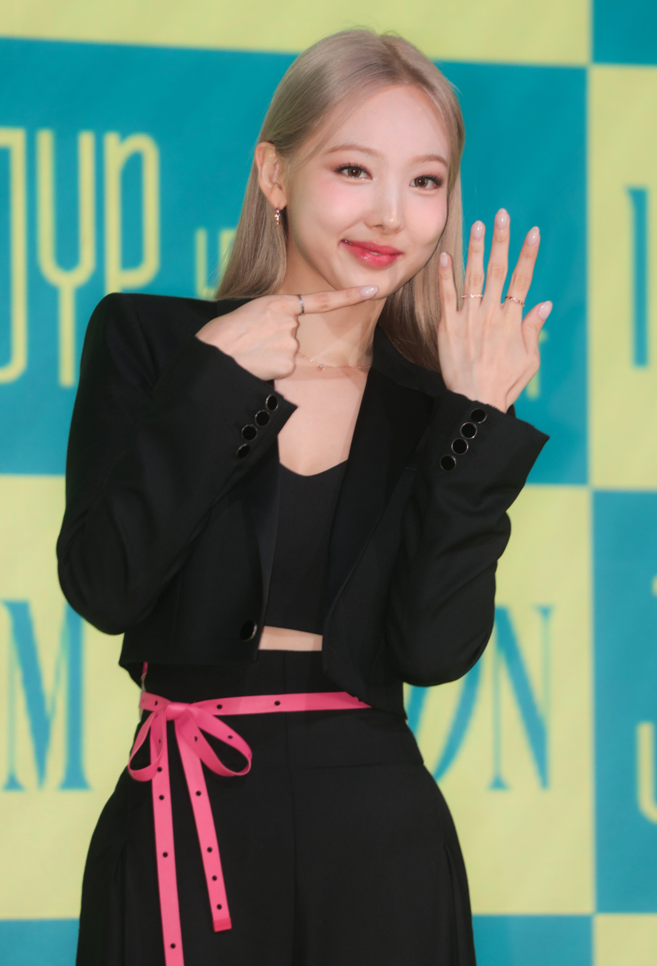 Nayeon, a member of TWICE, poses for the camera during a press conference for 