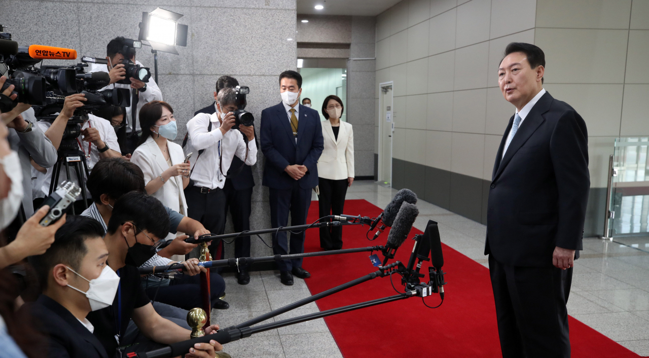 President Yoon Suk-yeol takes reporters' questions at the presidential office in Seoul on Monday. (Yonhap)