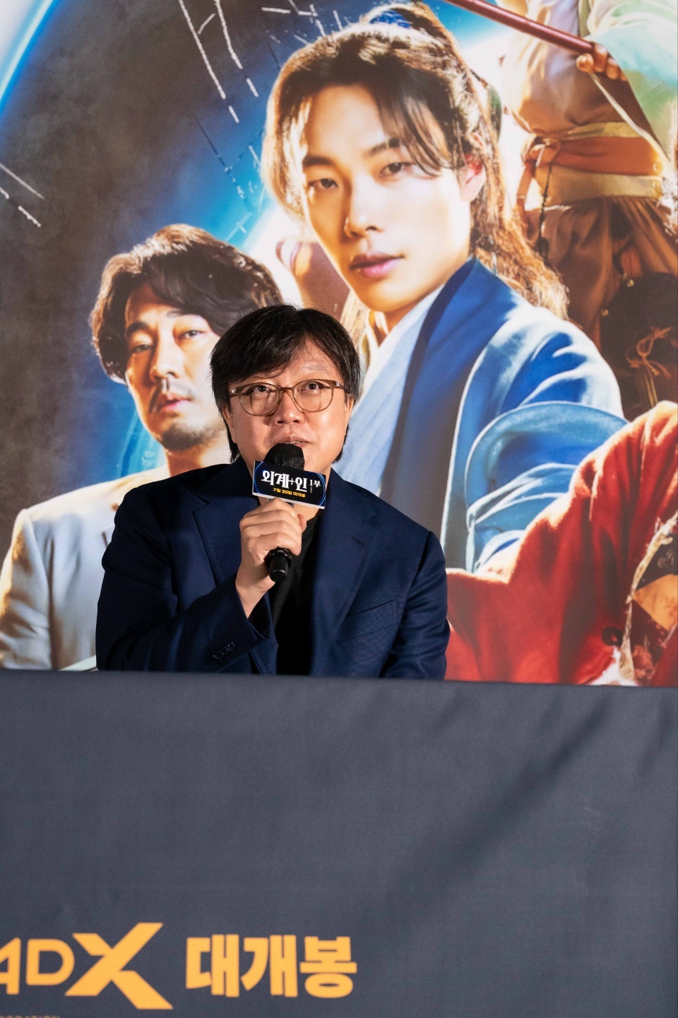 Director Choi Dong-hoon speaks at a press conference at CGV Yongsan in central Seoul on Wednesday. (CJ ENM)