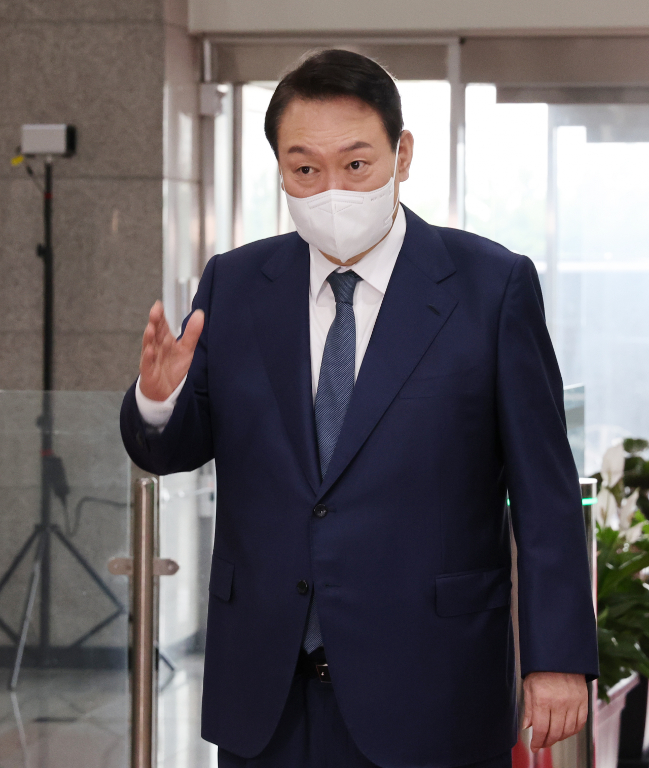 President Yoon Suk-yeol speaks to reporters as he arrives for work at the presidential office in Seoul on Monday. (Yonhap)