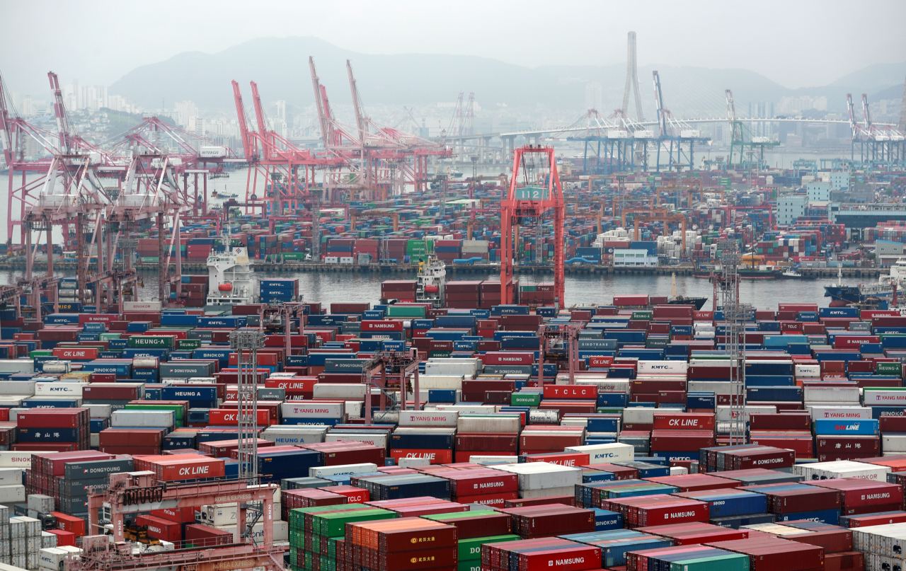 This file photo taken last Monday, shows stacks of containers at a port in South Korea's southeastern city of Busan. (Yonhap)