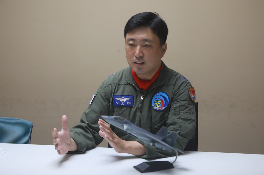 This undated photo, provided by the Defense Acquisition Program Administration, shows Maj. Ahn Jun-hyun, a KF-21 fighter pilot, speaking in an interview. (Yonhap)