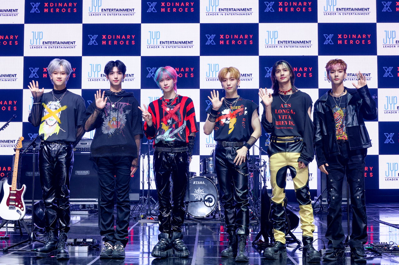 Rookie rock band Xdinary Heroes pose during a press conference for their first EP, “Hello, World!” in Seoul on Wednesday. (JYP Entertainment)
