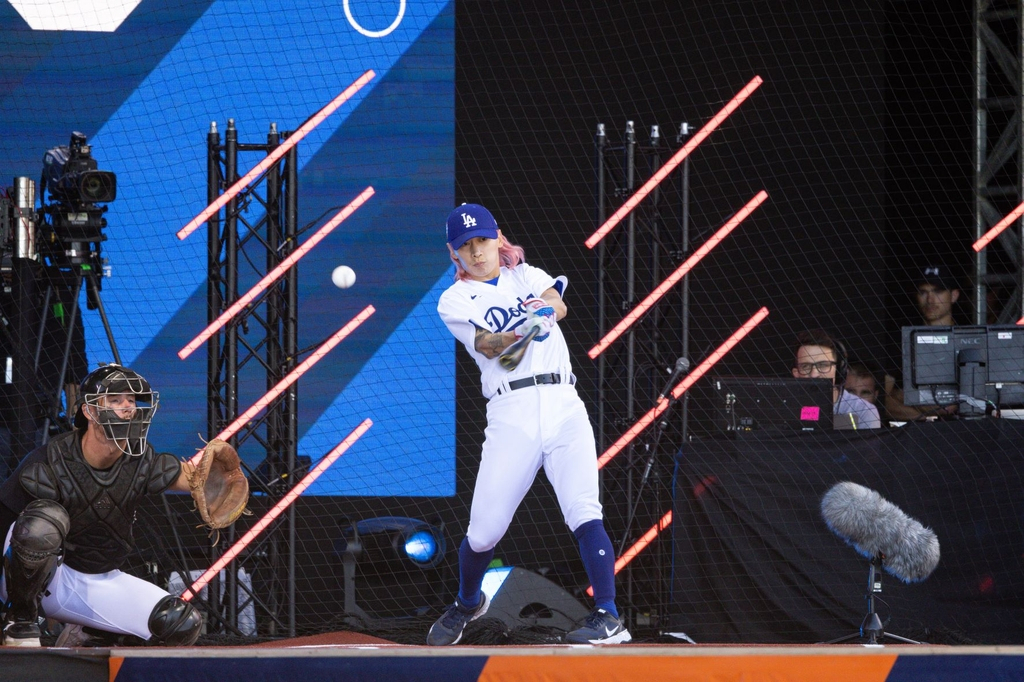 South Korean short track speed skater Kwak Yoon-gy (R) takes a swing during FTX MLB Home Run Derby X at Crystal Palace Park in London on July 9, in this file photo provided by Major League Baseball. Major League Baseball)