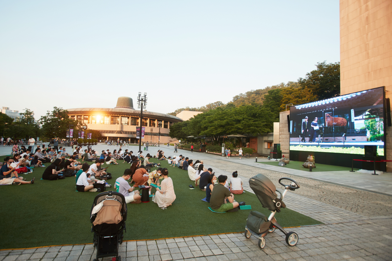 Visitors enjoy “Night Goblin Screening” at the garden compound of the Seoul Arts Center on July 2. (SAC)