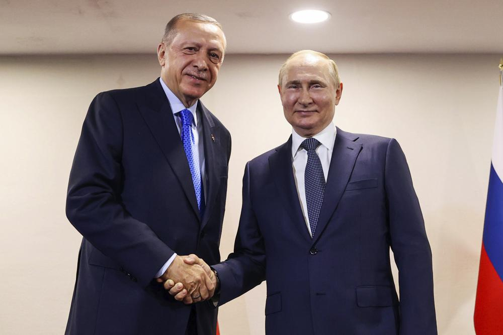 In this handout photo provided by the Turkish Presidency, Turkish President Recep Tayyip Erdogan, left, shakes hands with Russian President Vladimir Putin during their meeting, in Tehran, Iran, last Tuesday. The Biden administration likes to say that Russia is now isolated internationally because of its invasion of Ukraine. Yet its top officials are hardly sitting lonely and isolated in the Kremlin and now the US wants to talk.(Turkish Presidency via AP, File)