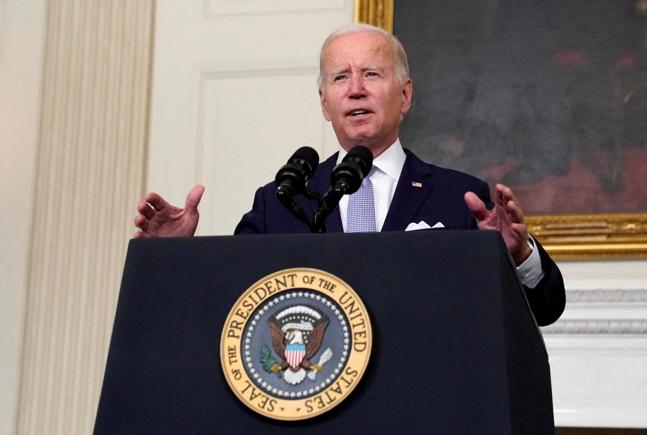US President Joe Biden gestures as he delivers remarks on the Inflation Reduction Act of 2022 at the White House in Washington, US, in July. (Reuters-Yonhap)