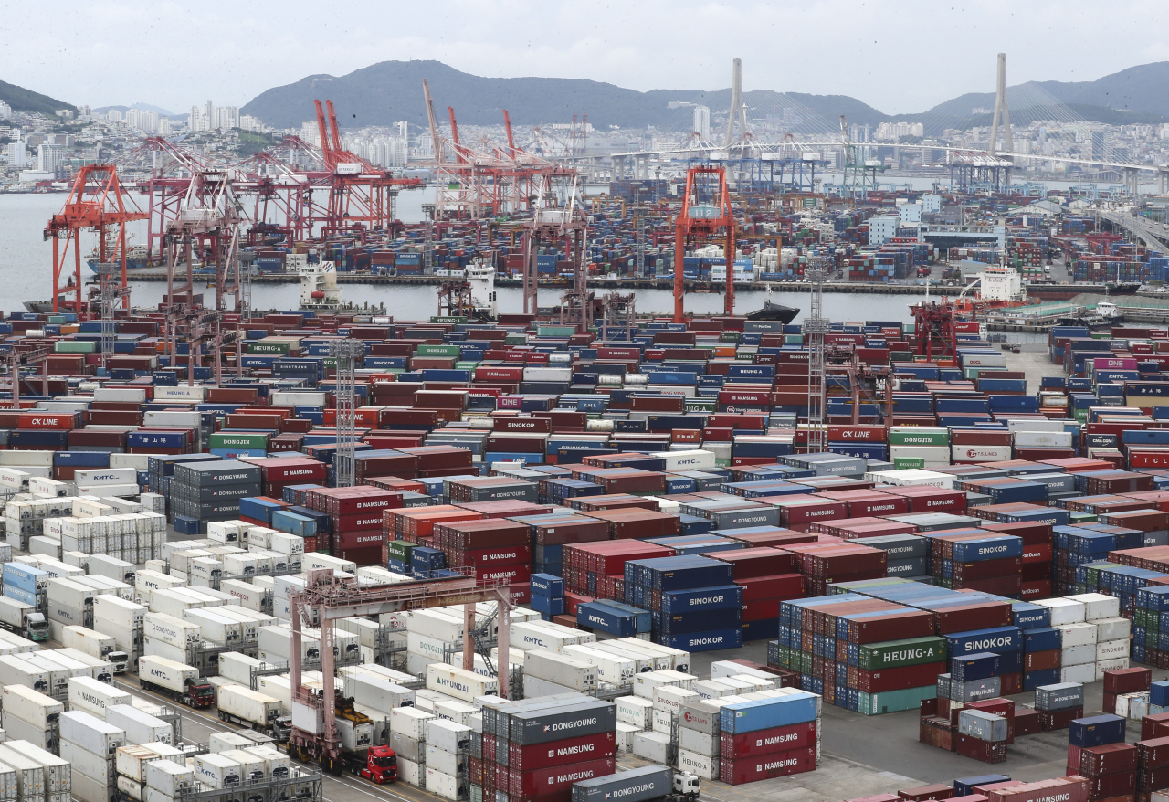 This file photo taken last Thursday shows containers stacked at the port of Busan in southeastern South Korea.  (union)