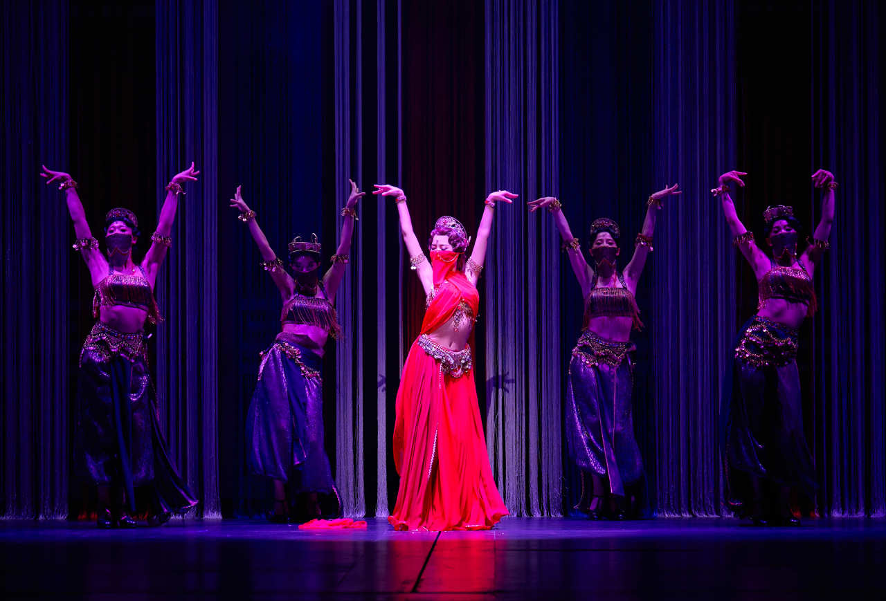 Solar (center) performs with dancers in “Mata Hari.” (EMK Musical Co.)