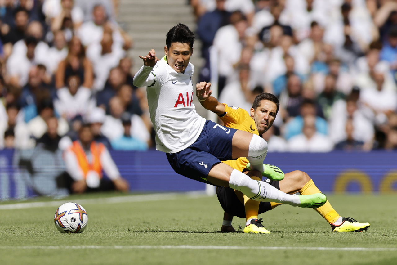 n this EPA photo, Son Heung-min of Tottenham Hotspur (L) is tackled by Joao Moutinho of Wolverhampton Wanderers during the clubs' Premier League match at Tottenham Hotspur Stadium in London last Saturday. (EPA)