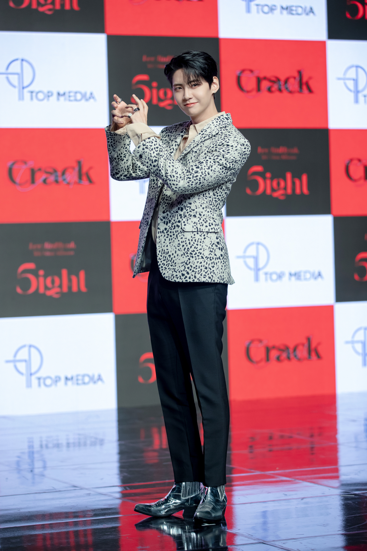 Up10tion’s Lee Jin-hyuk poses for photos during a press event for his fifth solo EP, “5ight,” in western Seoul, Monday. (Top Media)